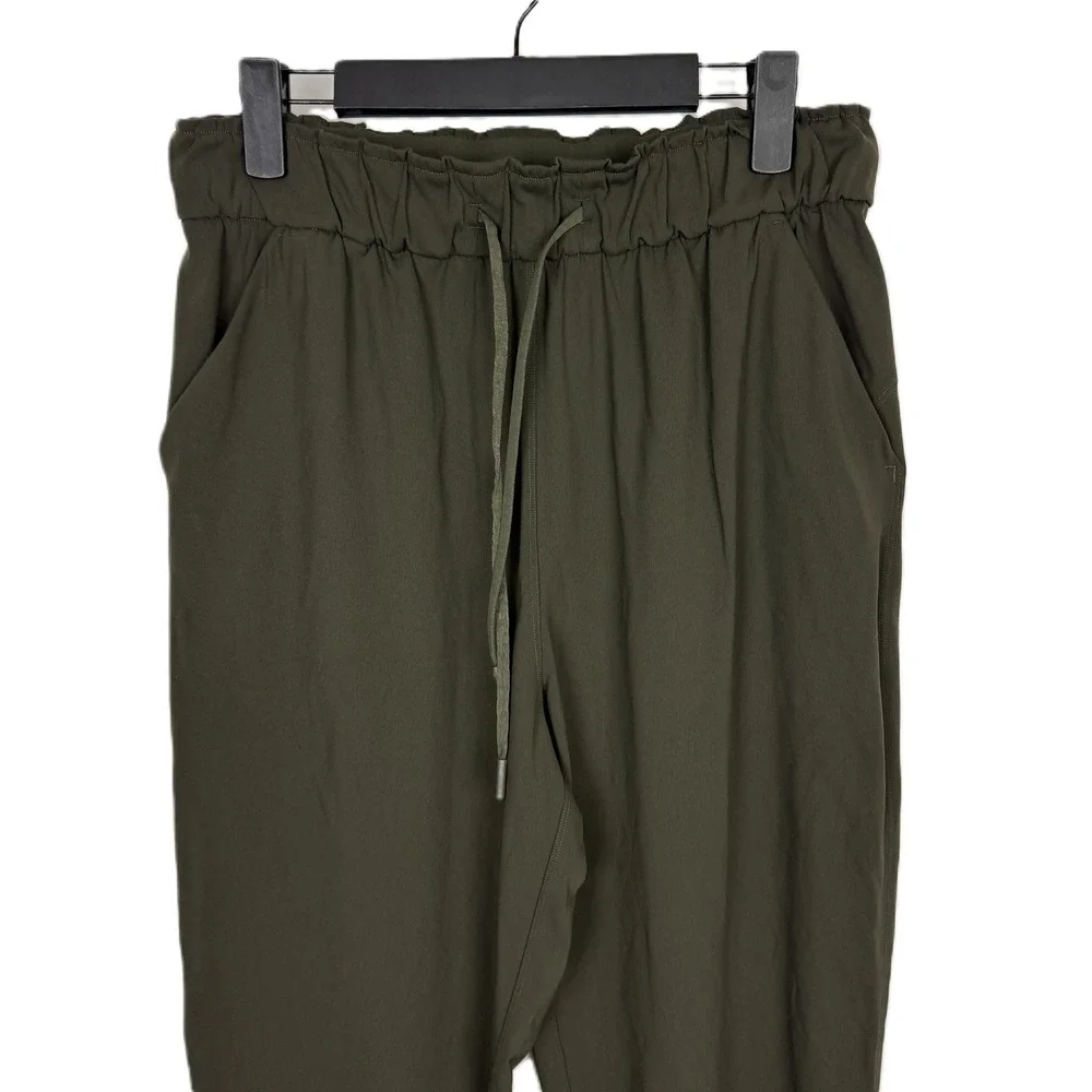 Lululemon On The Fly Jogger Dark‎ Olive Green Elastic Waist Size 8 FLAWED